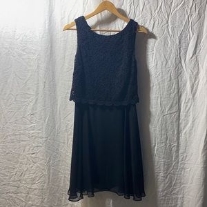 Black Laura Petites dress size 8 with floral lace overlay.